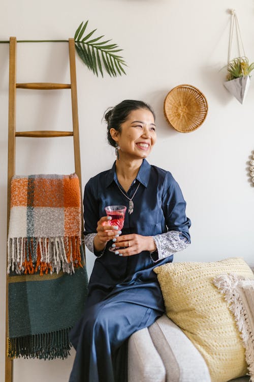 Smiling Woman Holding A Glass Of Wine