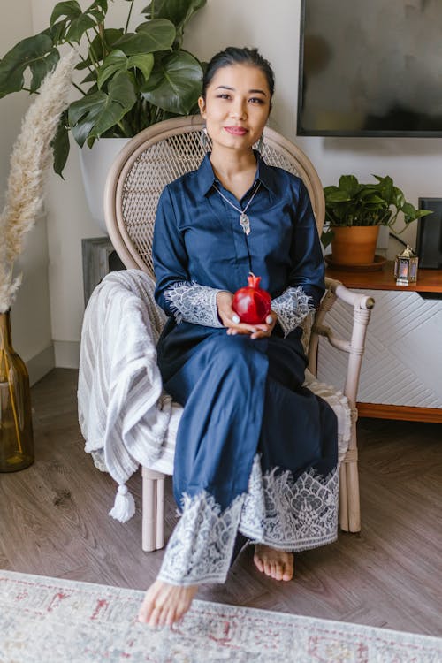 Woman Sitting On A Chair With A Candle