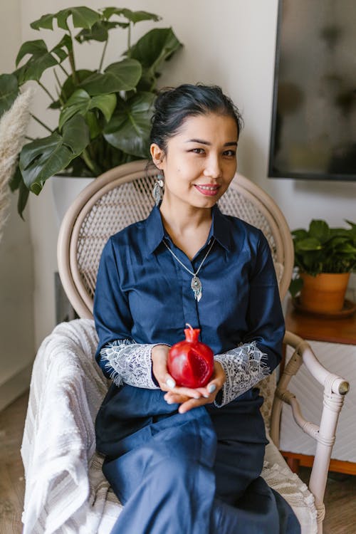 Woman Holding A Red Candle