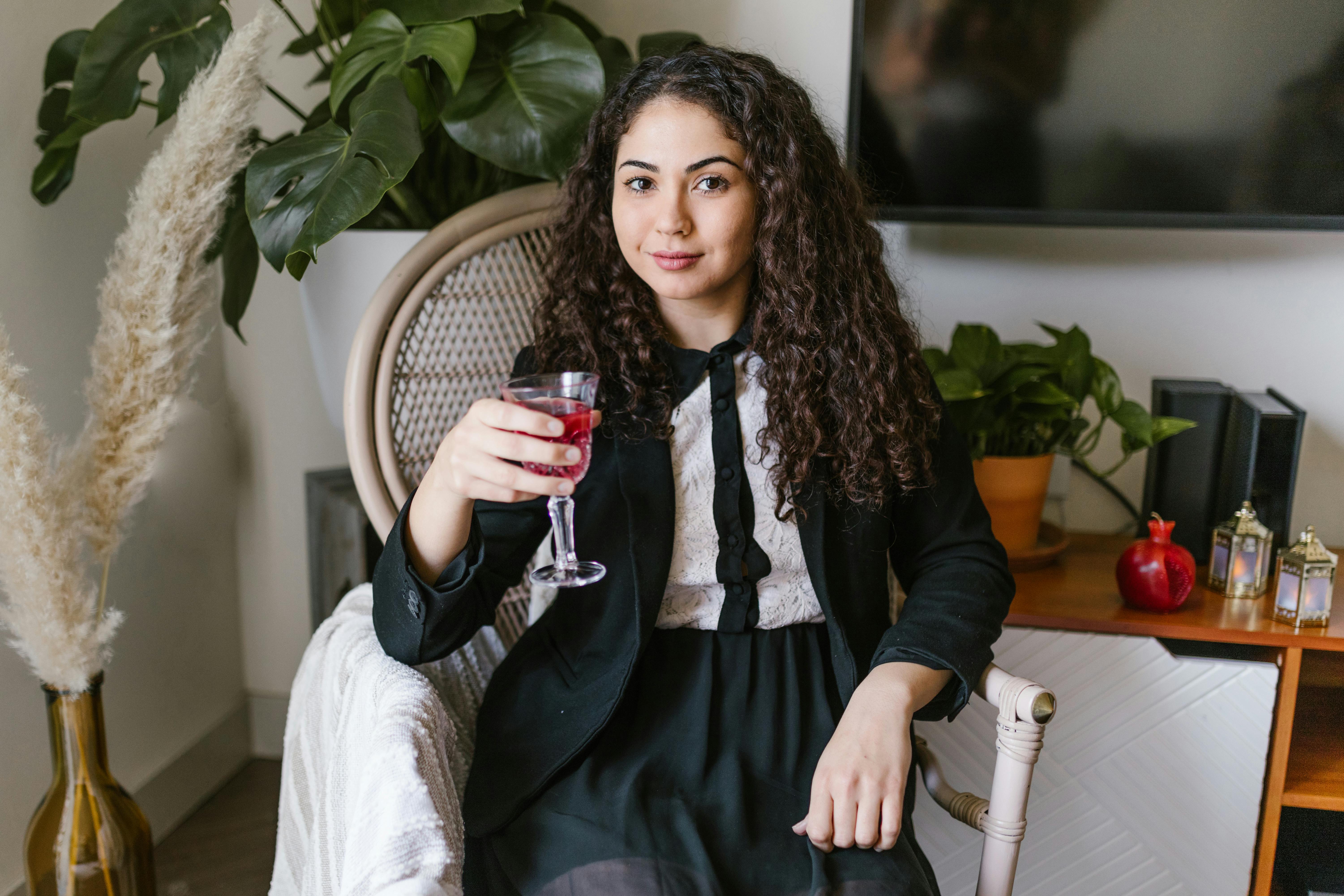 woman holding a glass of wine