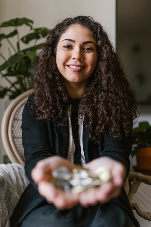 Woman Holding Coins On Her Hands
