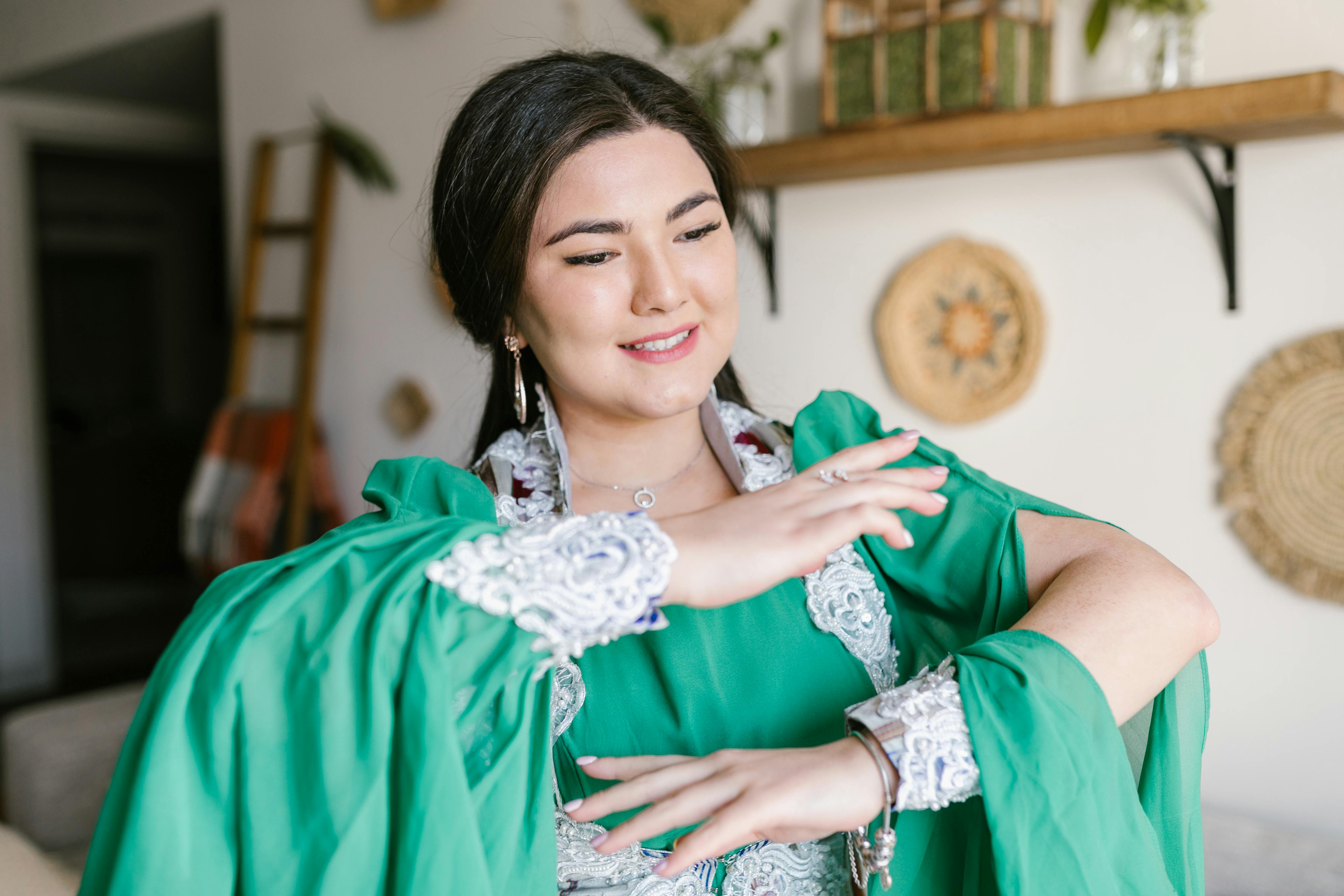 dancing woman in green and white dress