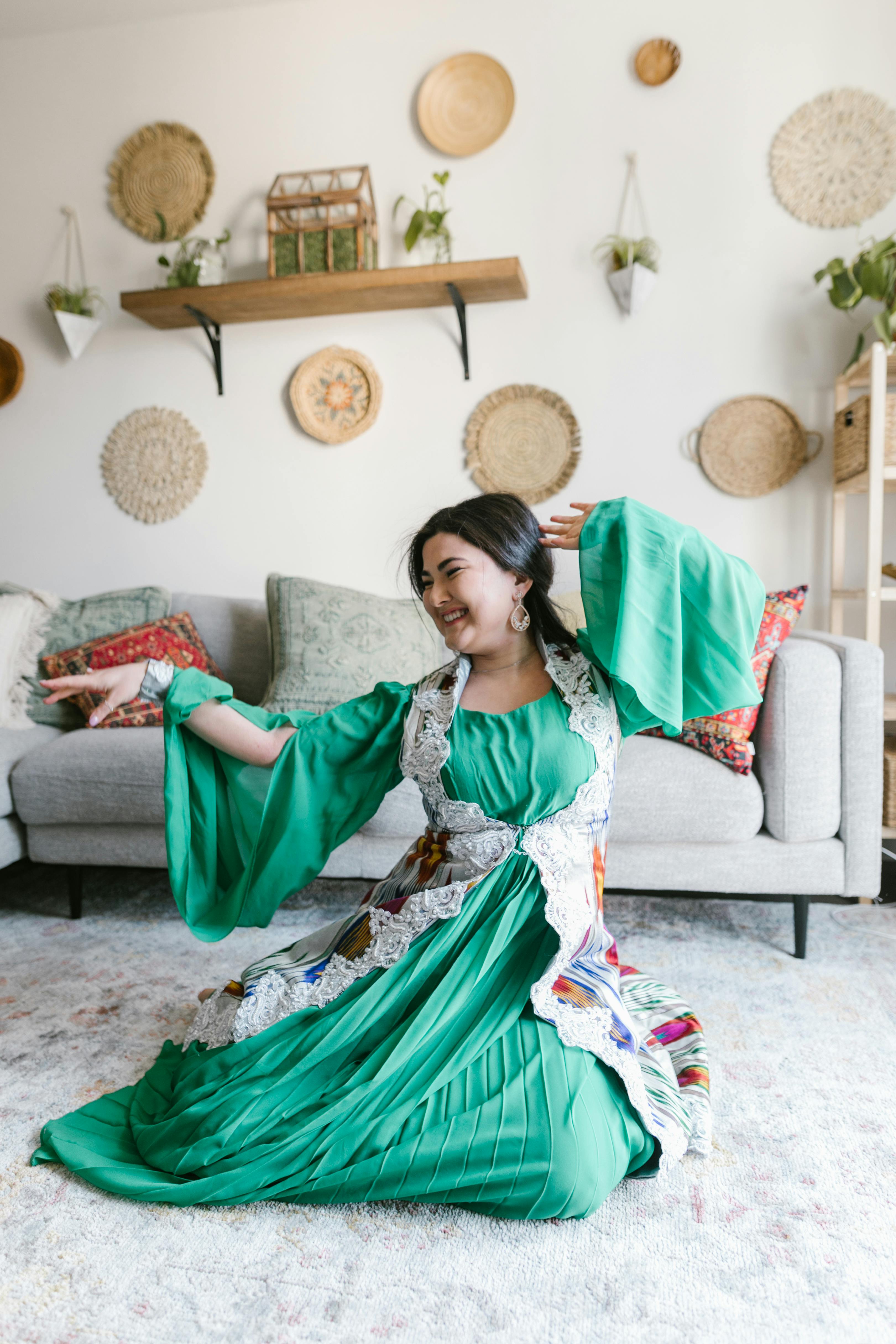 woman sitting on floor in a dancing position