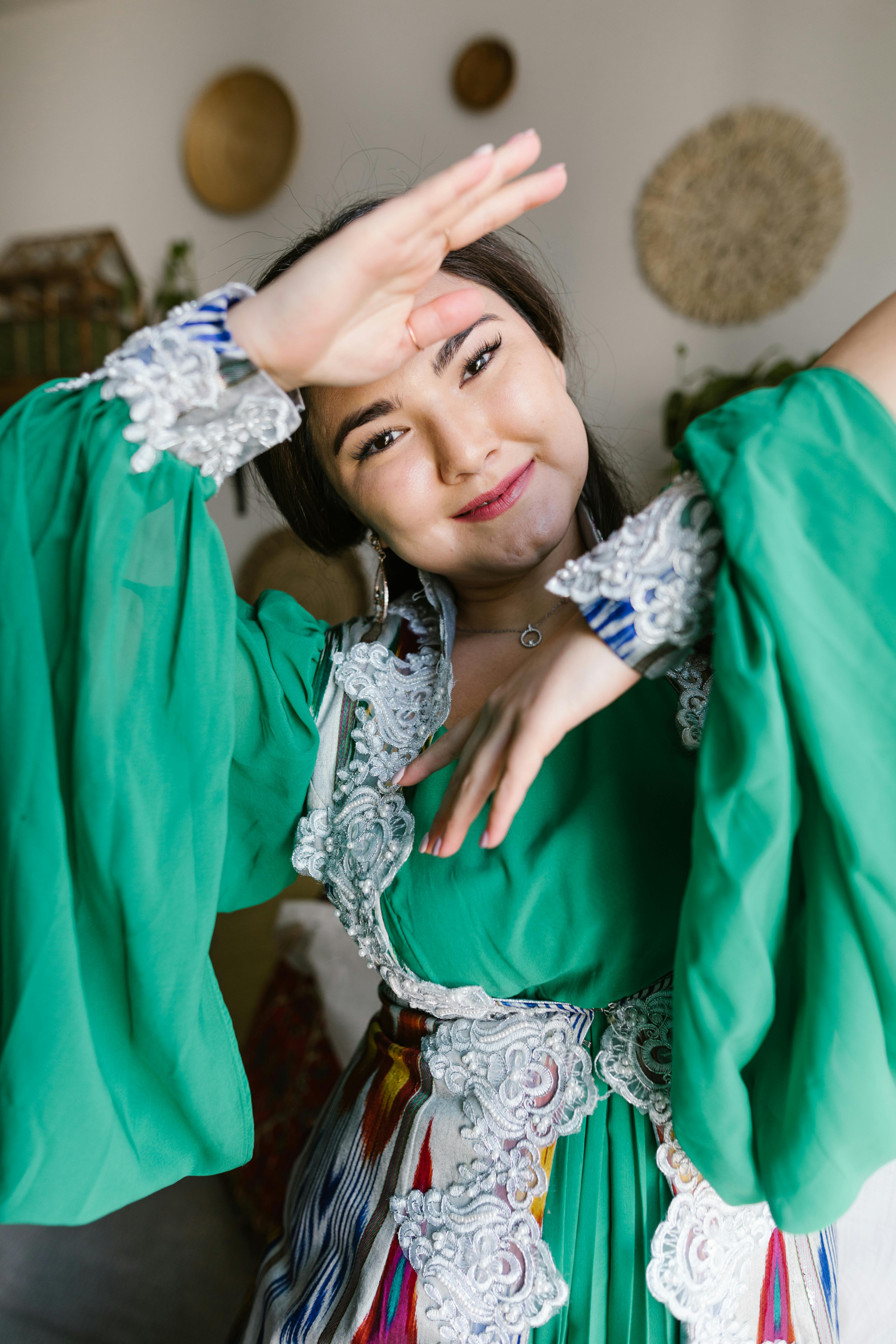 woman in green dress smiling