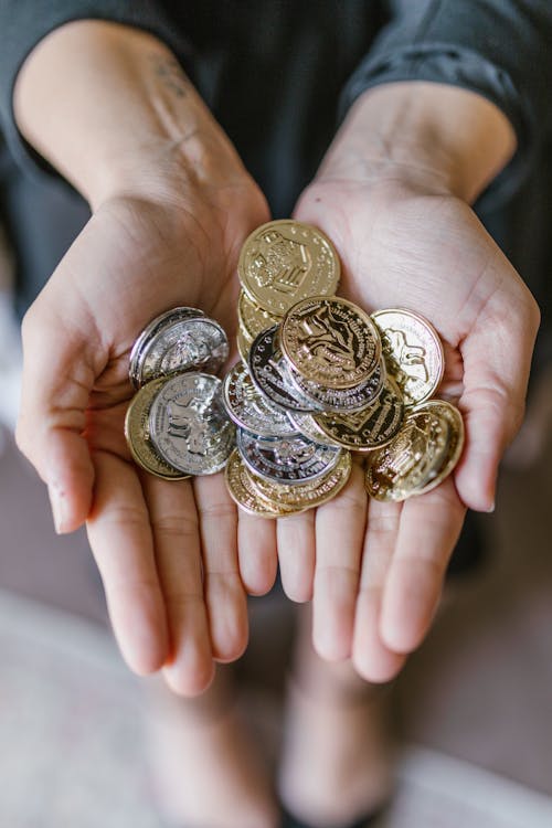 Anonymous Person Holding Coins