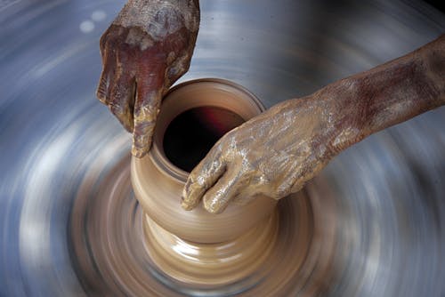Close-Up Shot of a Person Making a Clay Pot