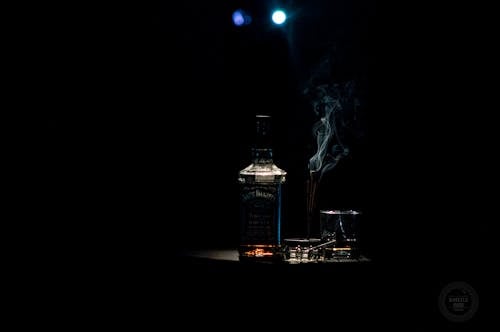 Closeup Photo of Liquor Bottle Against Black Background