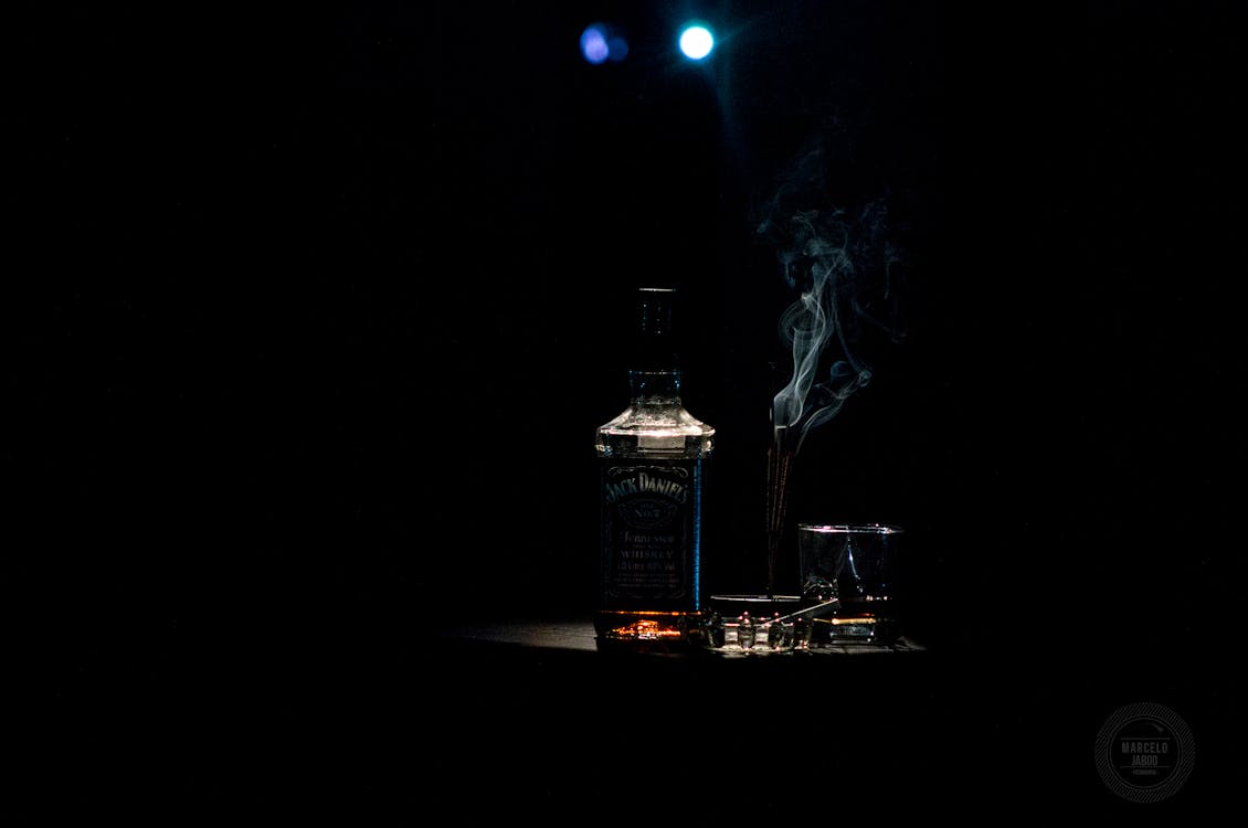 Closeup Photo of Liquor Bottle Against Black Background