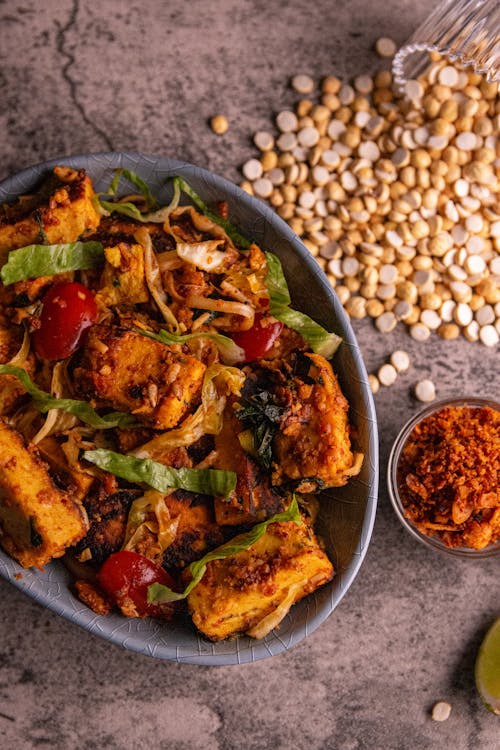 A Bowl of Cooked Food in a Bowl on a Rustic Background