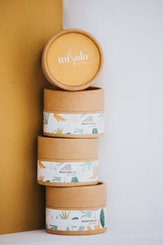 Stylish stack of eco-friendly Misolo skincare containers in artistic arrangement.