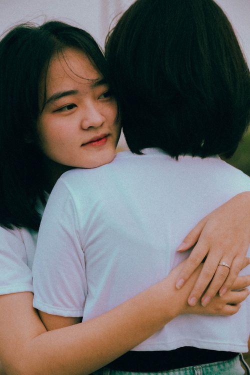 Free Heartfelt moment of two women hugging outdoors, showcasing friendship and connection. Stock Photo