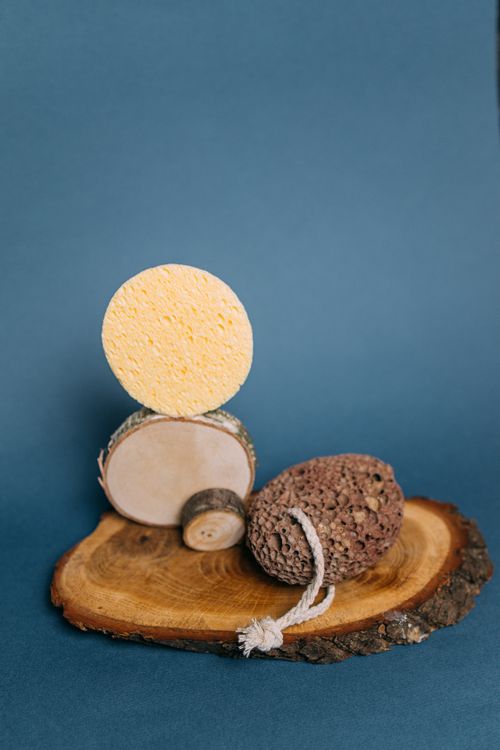 Free Organic spa essentials arranged on a wooden slab, perfect for home relaxation. Stock Photo