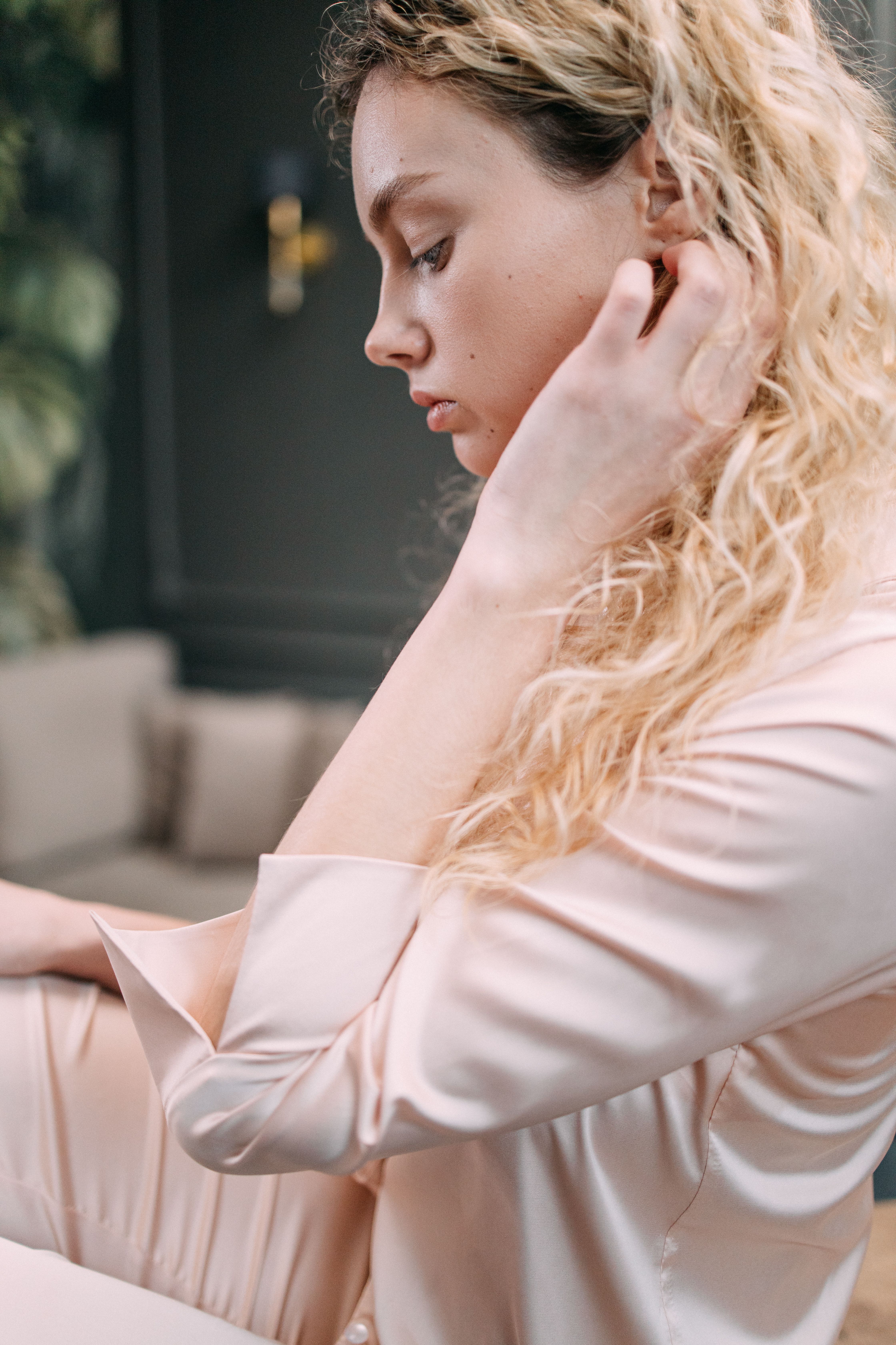 Woman in soft satin loungewear showing relaxed elegant fit