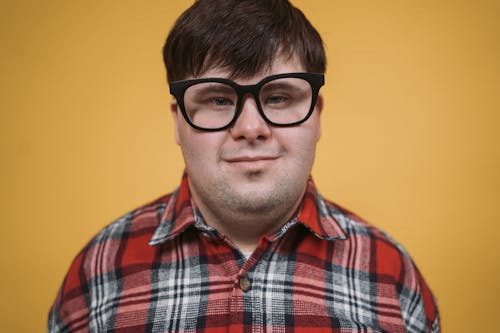 Close-Up Shot of a Man Wearing an Eyeglasses