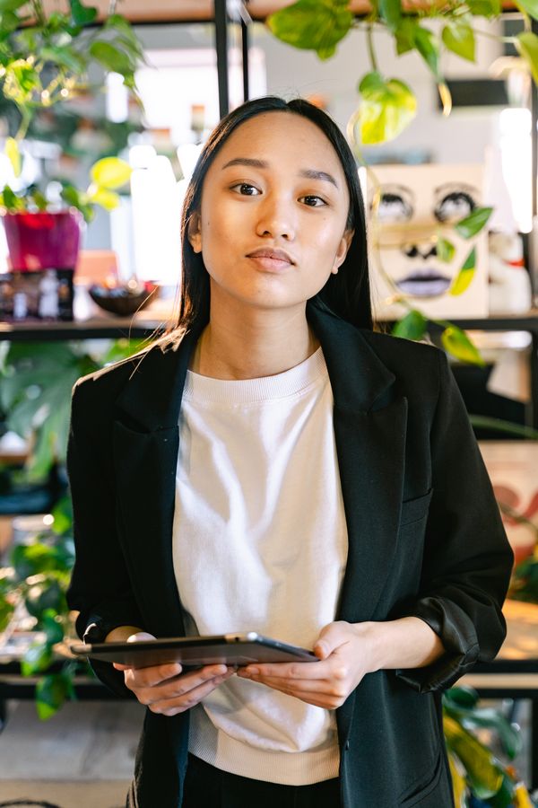 Woman wearing black blazer over white t-shirt office casual outfit