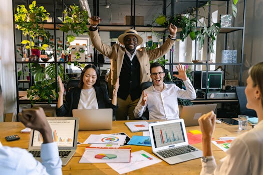 Colleagues celebrate a successful meeting in a vibrant office environment.