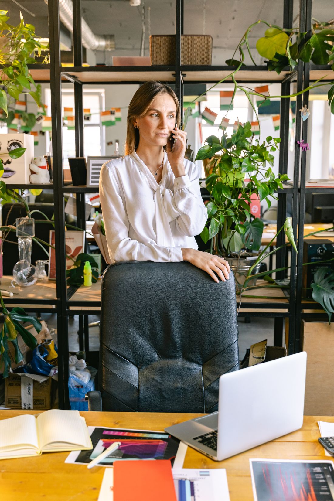 Businesswoman taking a call in a contemporary office