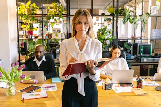 Diverse group of professionals collaborating in a greenery-filled modern office.
