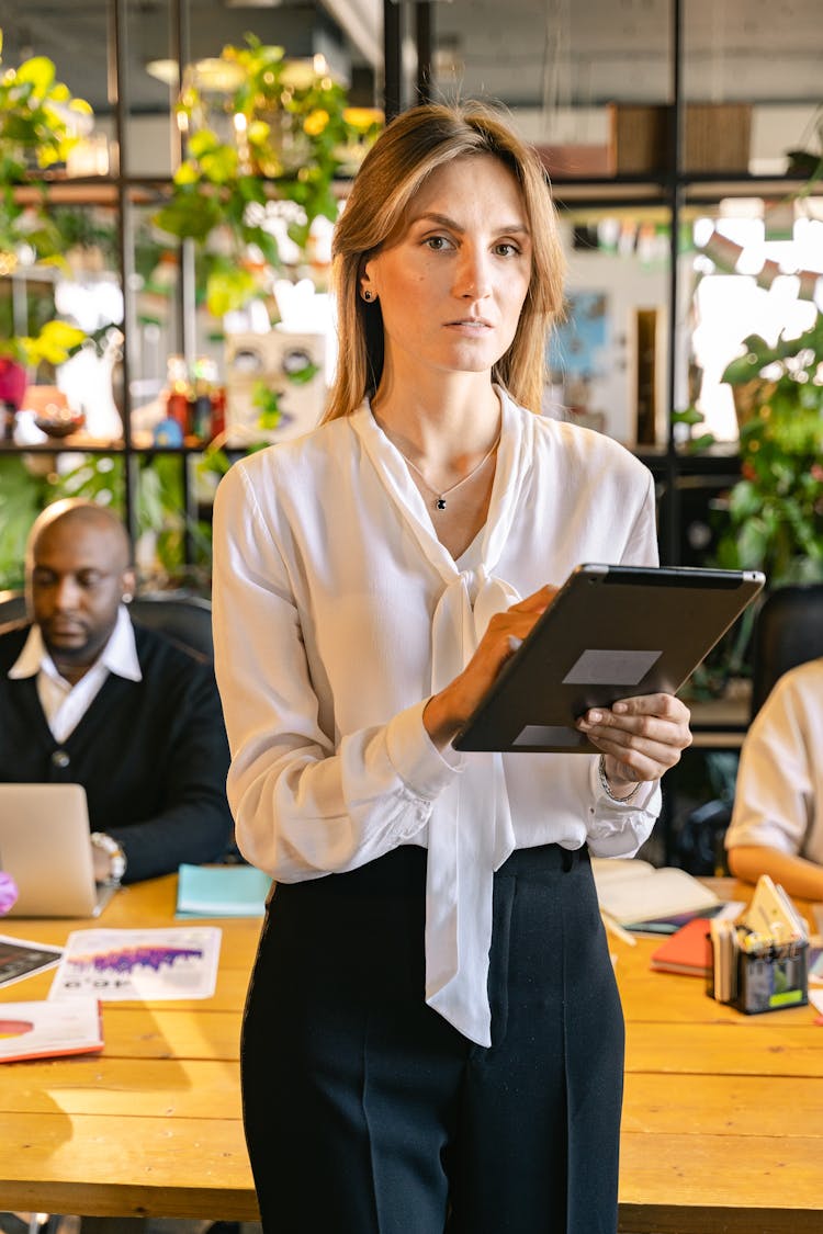 A Woman Holding A Tablet