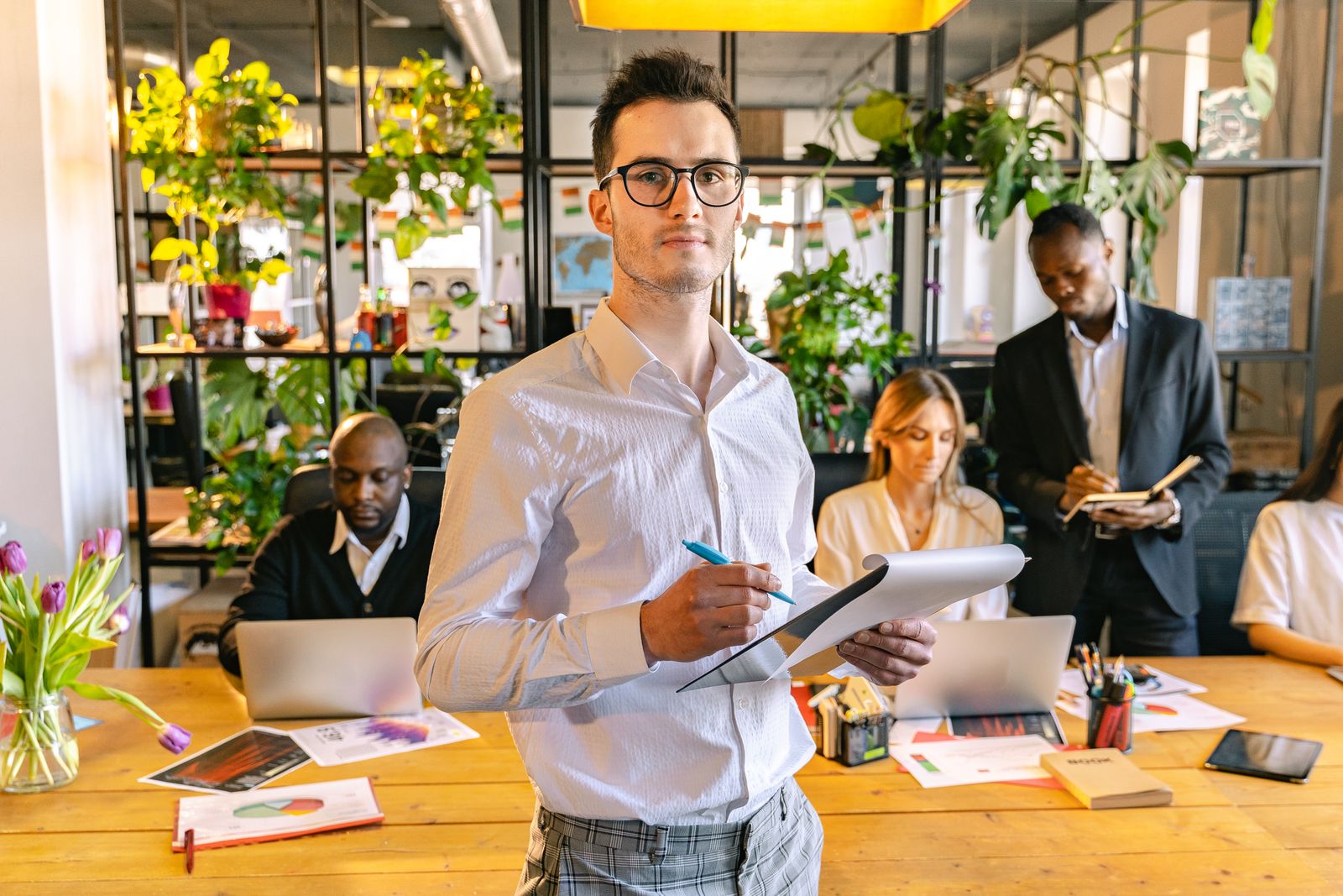 A collaborative technology team working in a contemporary office