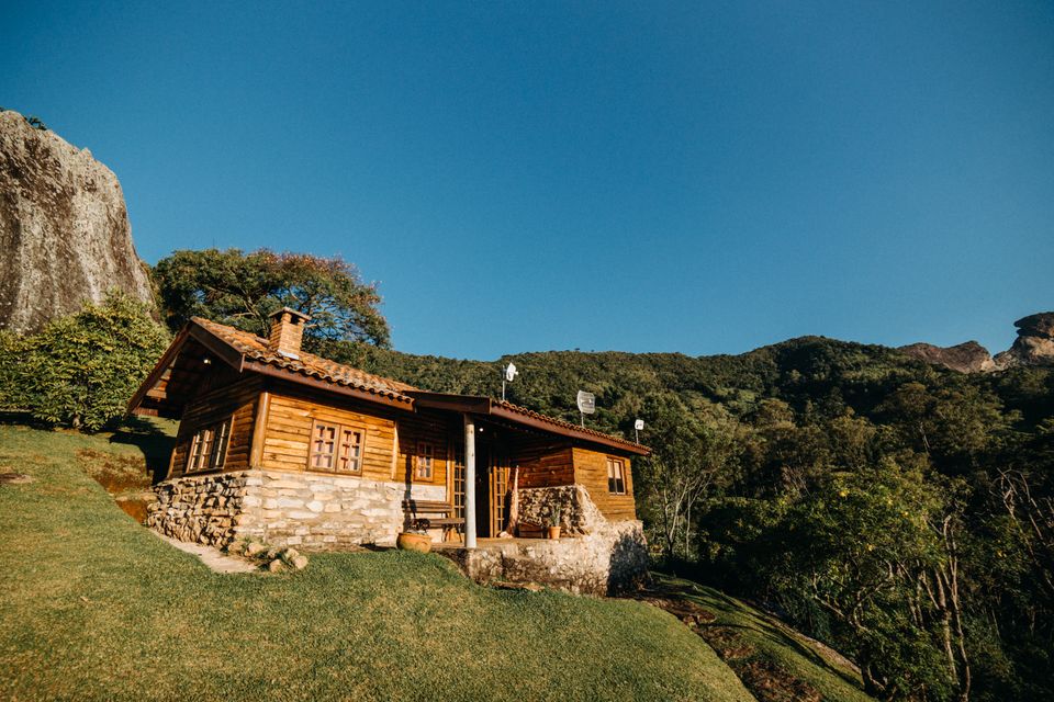 The crater ridgeline at golden hour, seen from a hillside terrace — the view that justifies choosing a hillside property over the town center