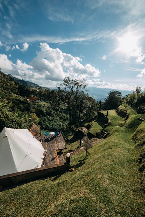 White tent on grassy terrain