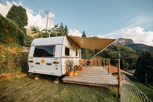 Camper Trailer with an Extension in Mountains 