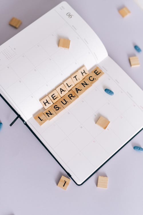 Health Insurance Scrabble Tiles on Planner 