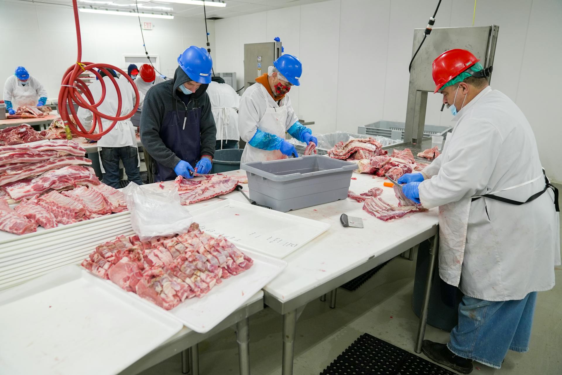 Butchers Slicing Meat