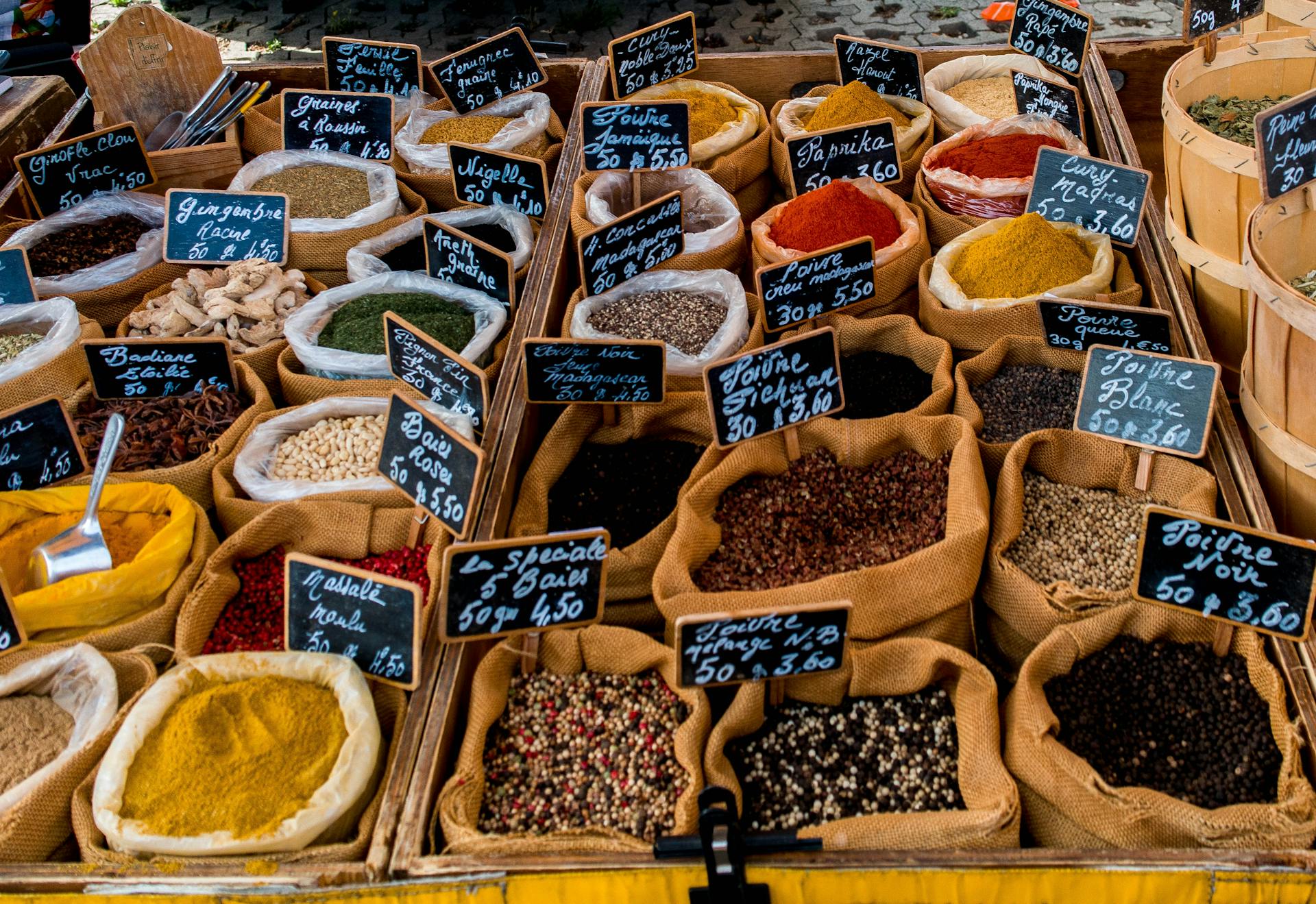 A vibrant array of spices displayed in sacks at a market in Montpellier, France.