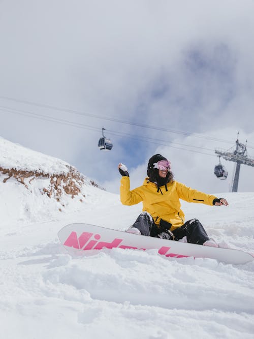 Low-Angle Shot of a Person Riding a Snowboard