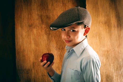 Boy Holding Red Apple