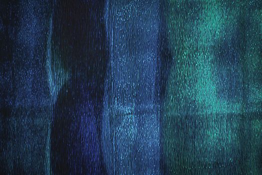 Close-up abstract image showcasing texture and patterns in blue and turquoise hues.