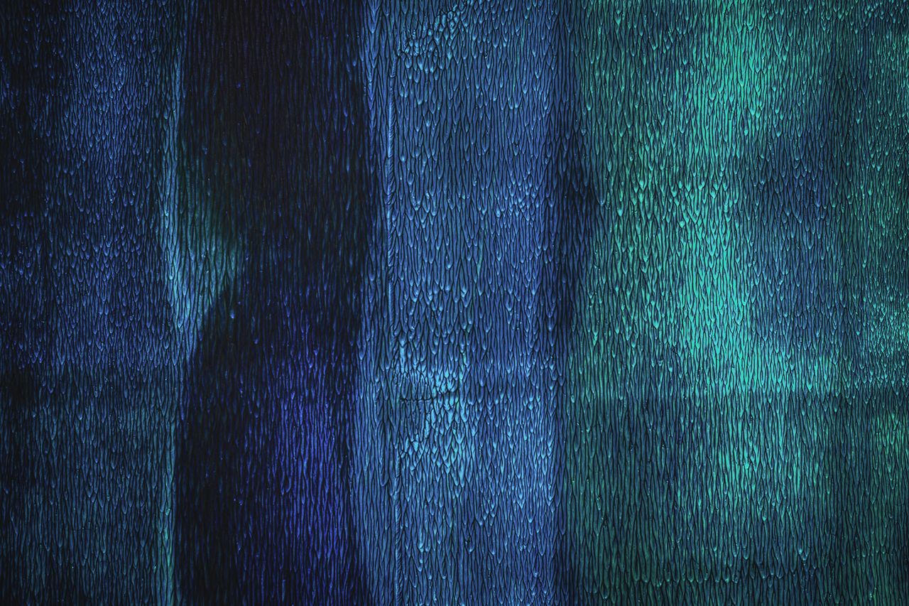 close up abstract image showcasing texture and patterns in blue and tu