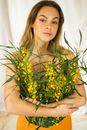 Woman Hugging a Bunch of Flowers for a Photoshoot