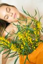 Woman Hugging a Bunch of Flowers for a Photoshoot