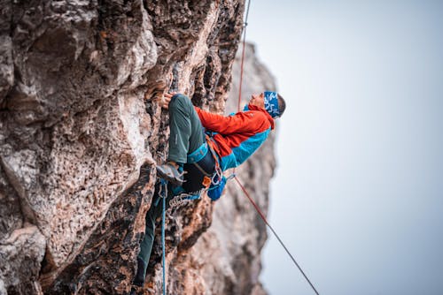 Man Climbing a Rock Mountain