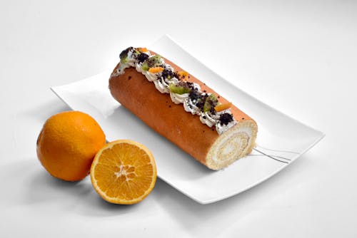 Orange Swiss roll topped with fruits