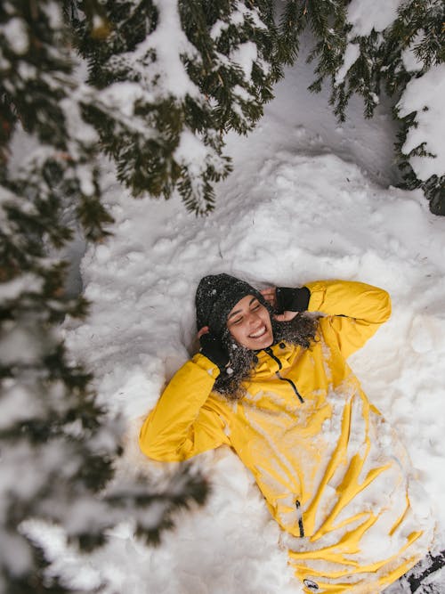 Free A Woman Lying Down on Snow  Stock Photo
