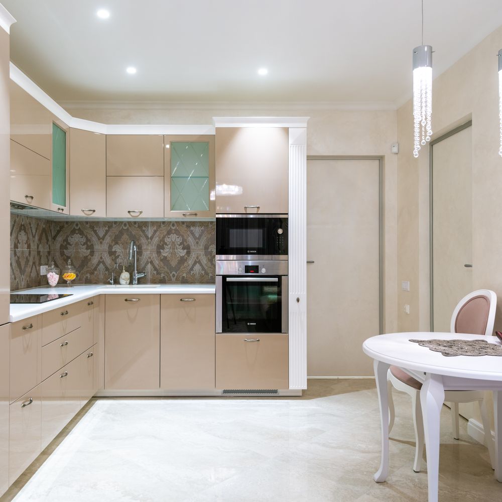 Kitchen Spraying in Muswell Hill — clean edges cut in around trim and sockets