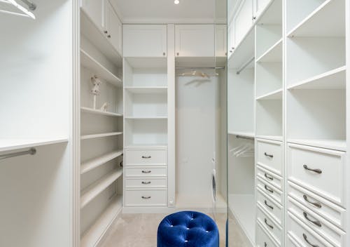 Free White classic styled built in wardrobe with empty shelves Stock Photo