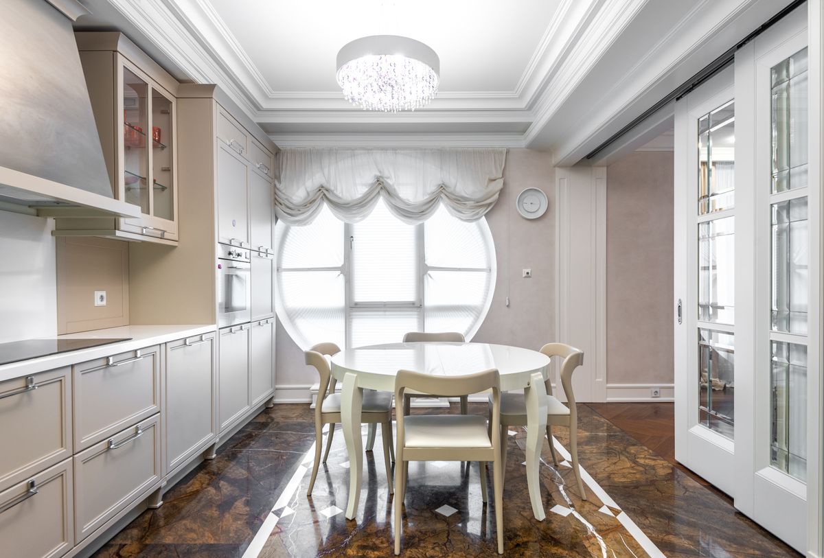 Bright dining kitchen with a long table and chairs at Gull House