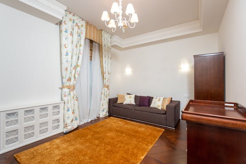 A Spacious Living Room with Chandelier