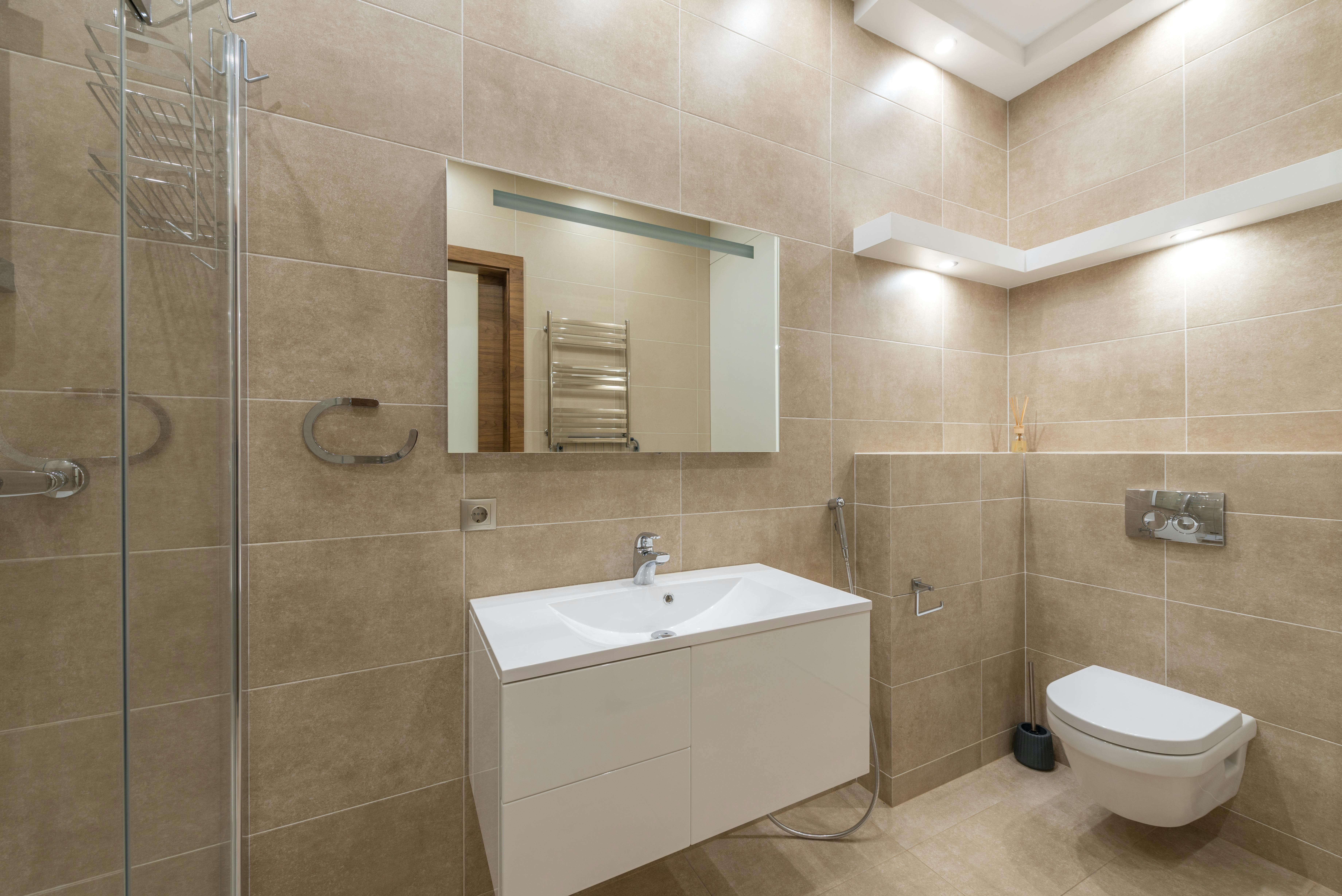 white ceramic sink with stainless steel faucet