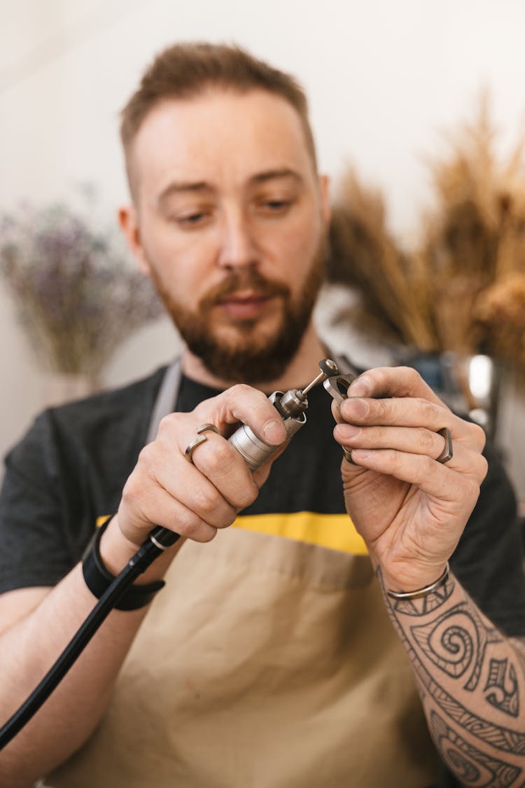 Man Polishing A Ring 