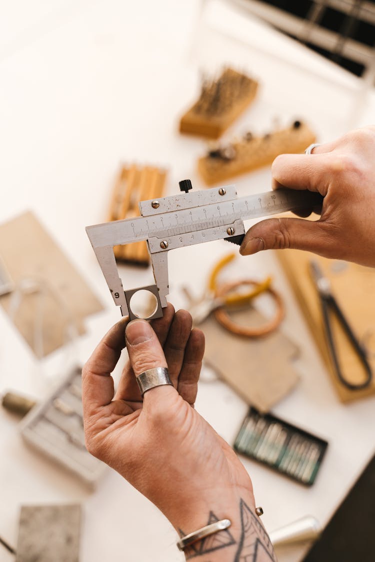 Hands Holding Measurement Tool