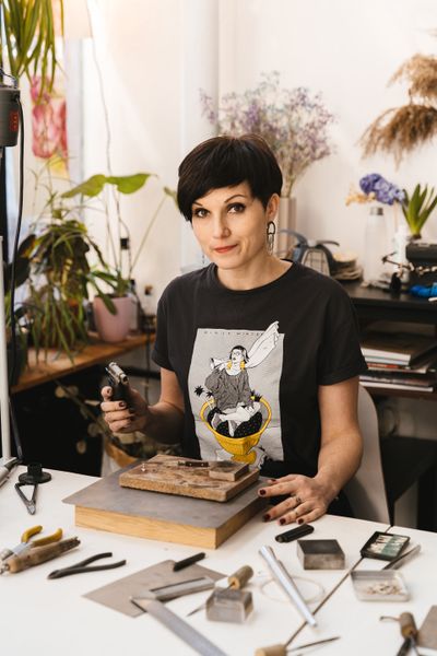 Jeweller at her workbench — photo by Adventure Studio on Pexels