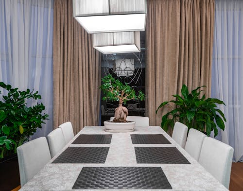 Interior of stylish dining room with light table