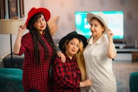 Women Posing while Wearing Hat