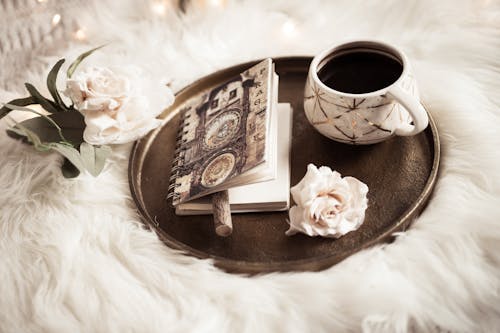 Free Brown and White Still Life with Coffee with Notebook on a Tray Stock Photo